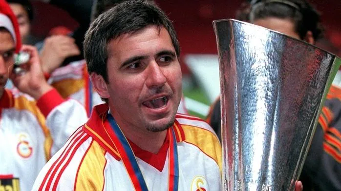 gheorghe hagi cradles the uefa cup after victory in the 2000 final with galatasaray